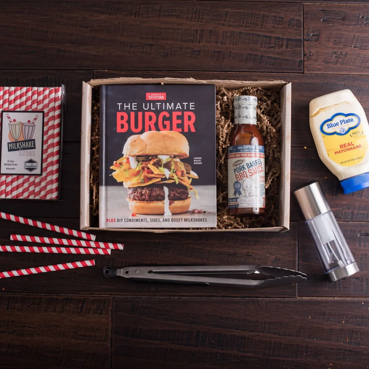 A CrateChef burger kit with cookbook and sauces