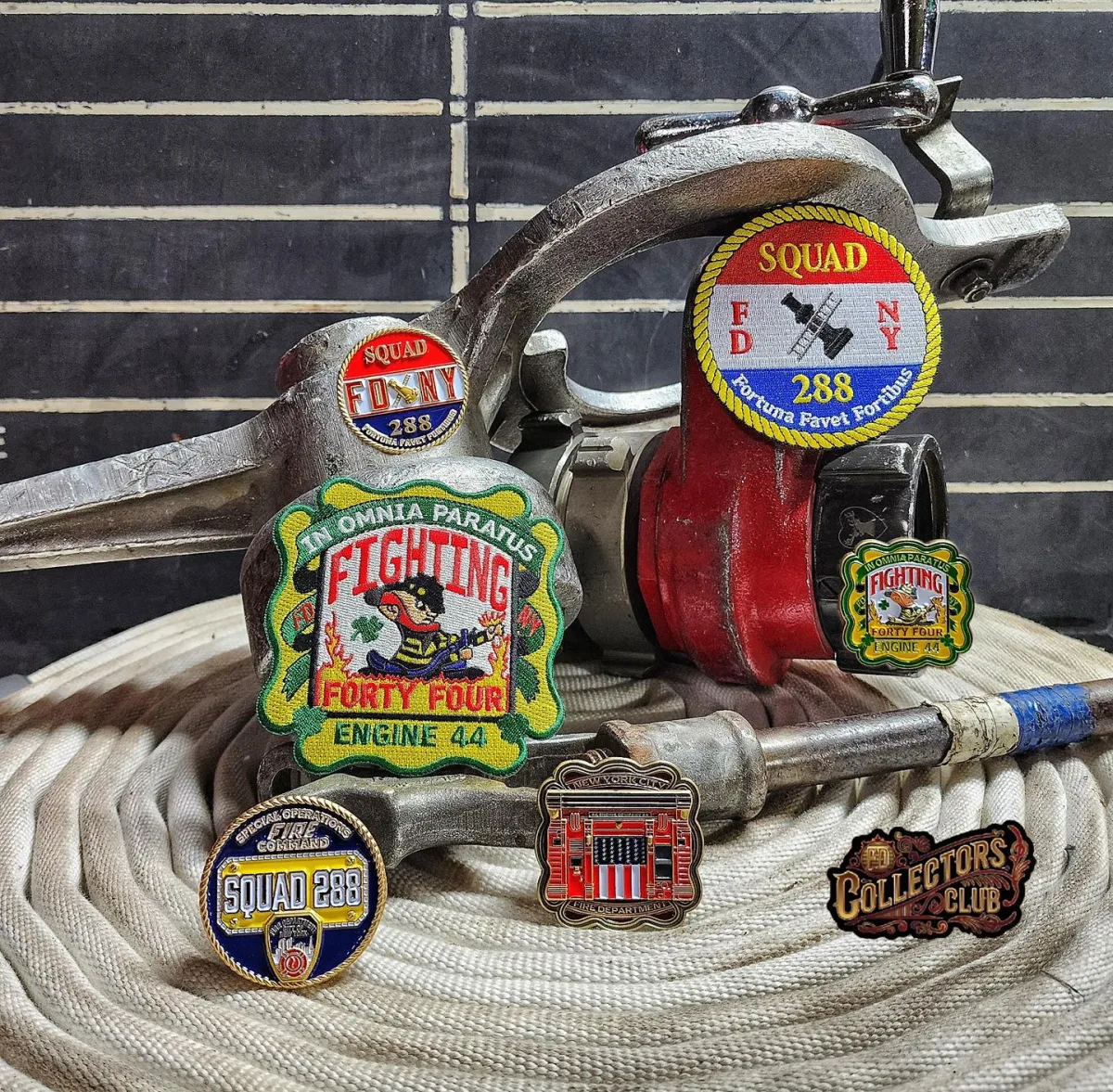 FD Collector's Club challenge coins on a fire hose