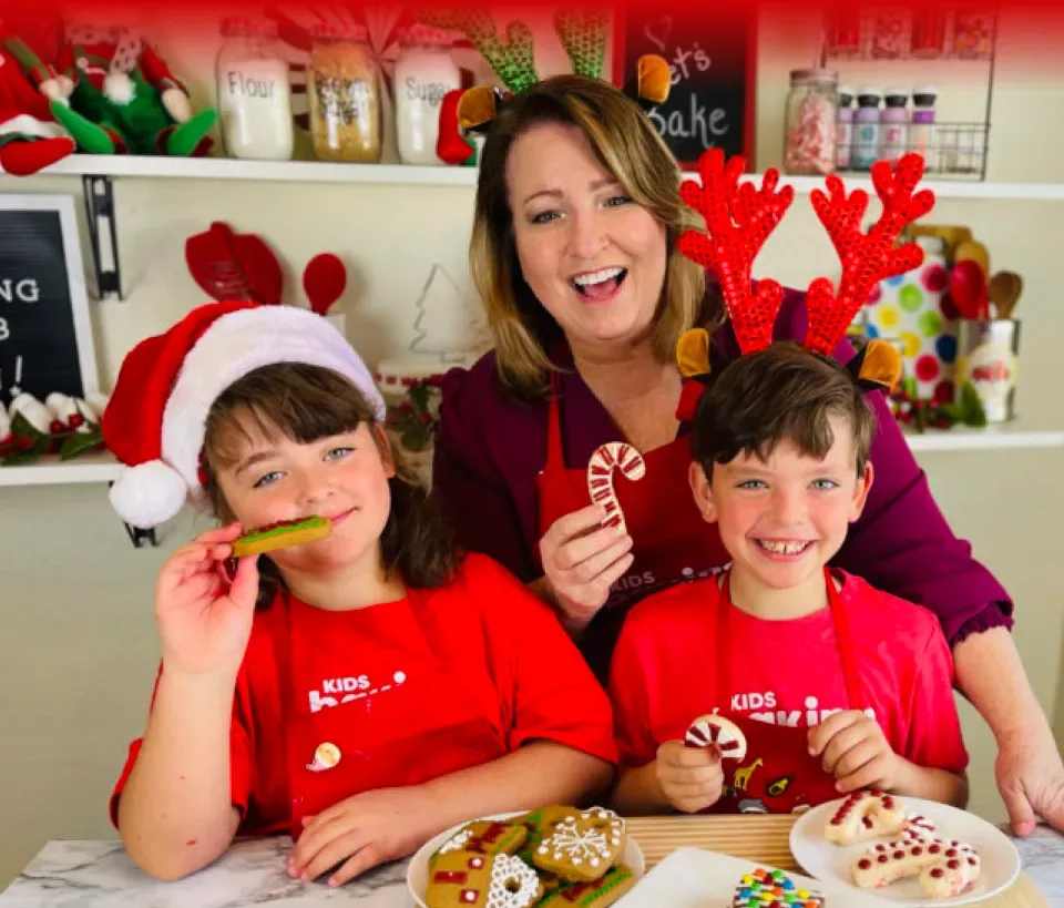 Decorating holiday cookies with two children