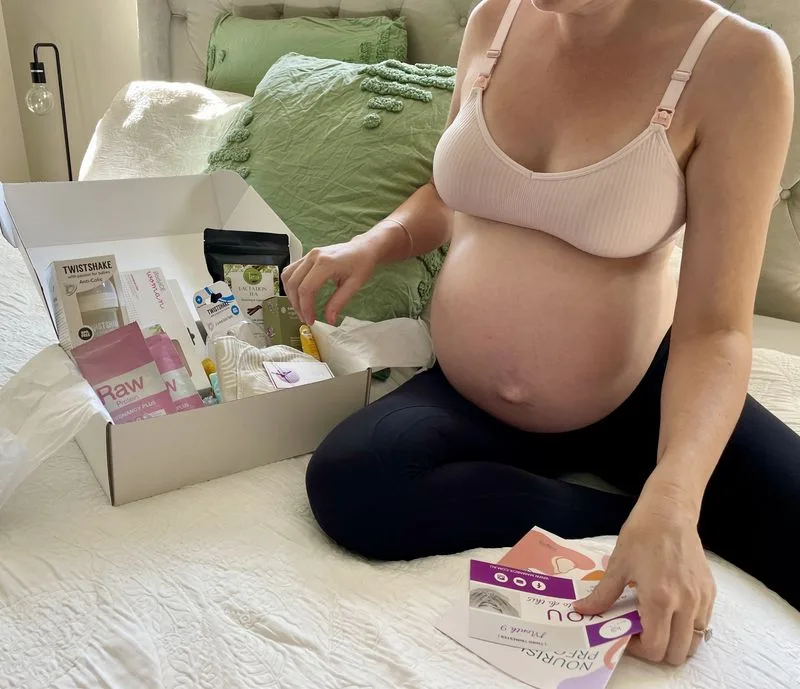 A pregnant woman with her Mama Box