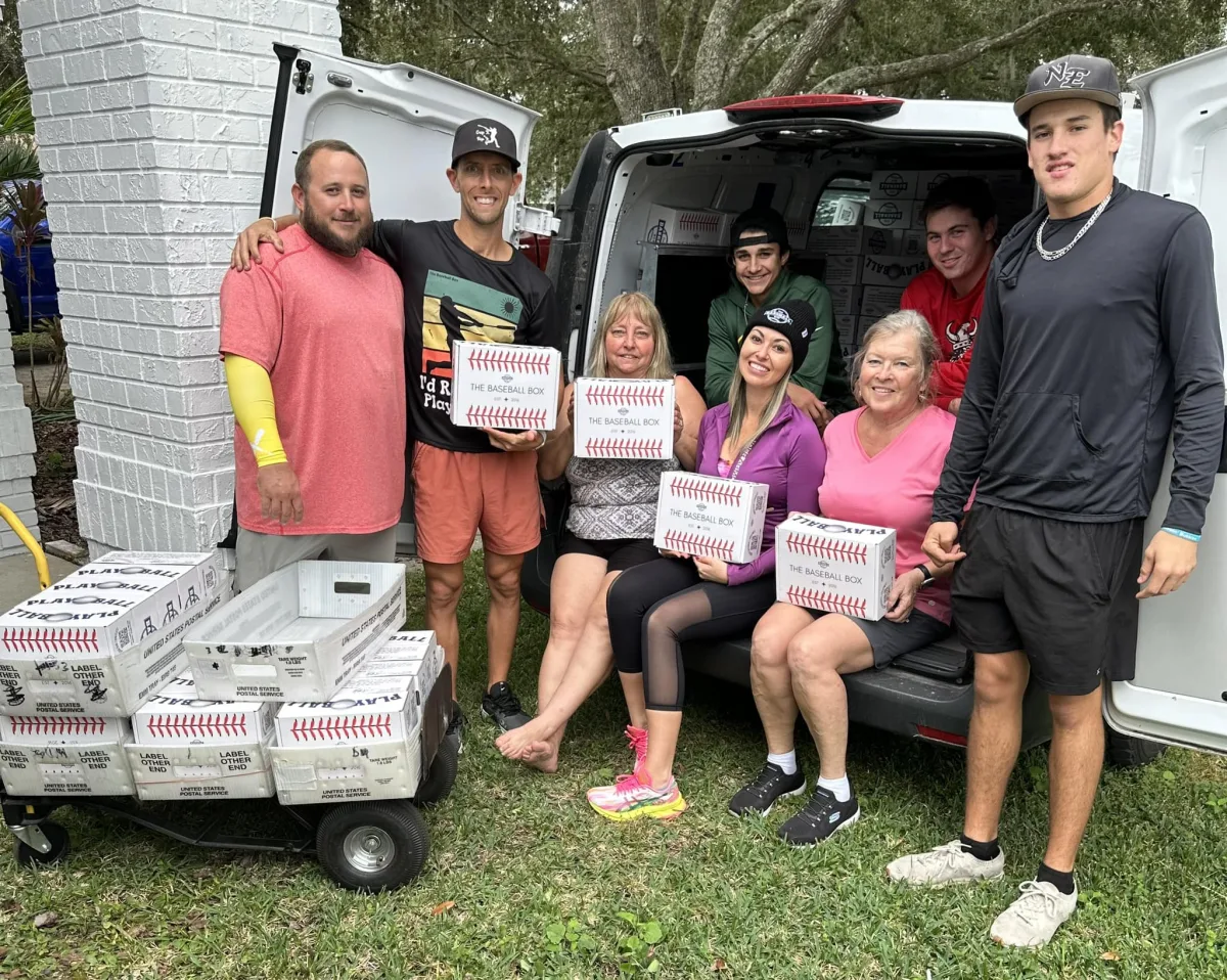 The Baseball Box team with boxes ready to ship