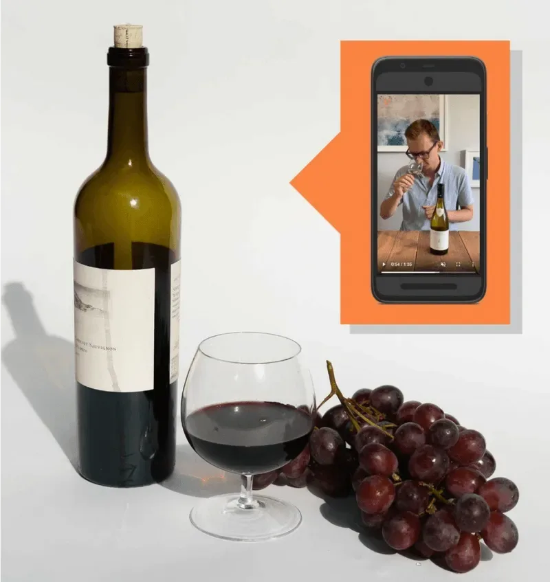 A VinoMojo wine with a video tasting on a phone